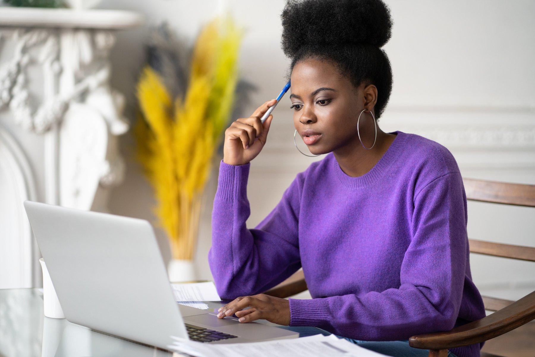 Diverse Female Student Studying with a Laptop on the Table